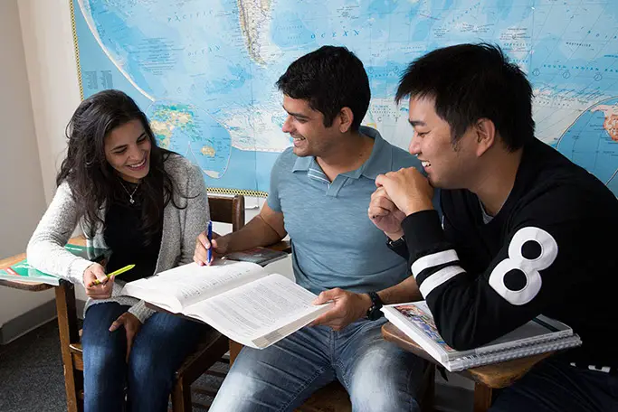 Past students working in a small group