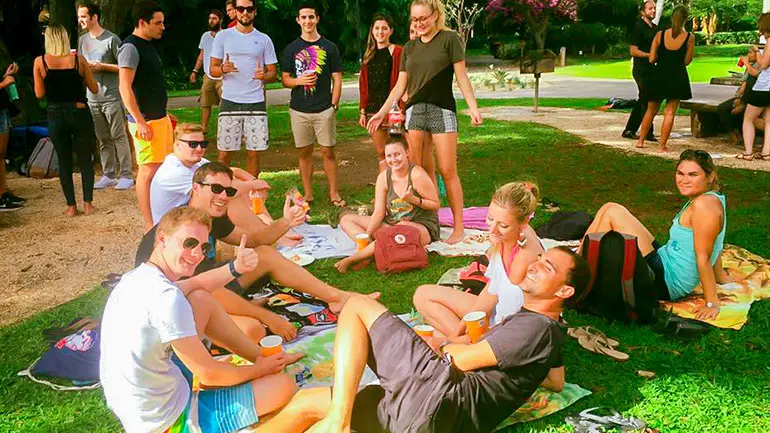 Past students at an outdoor social activity