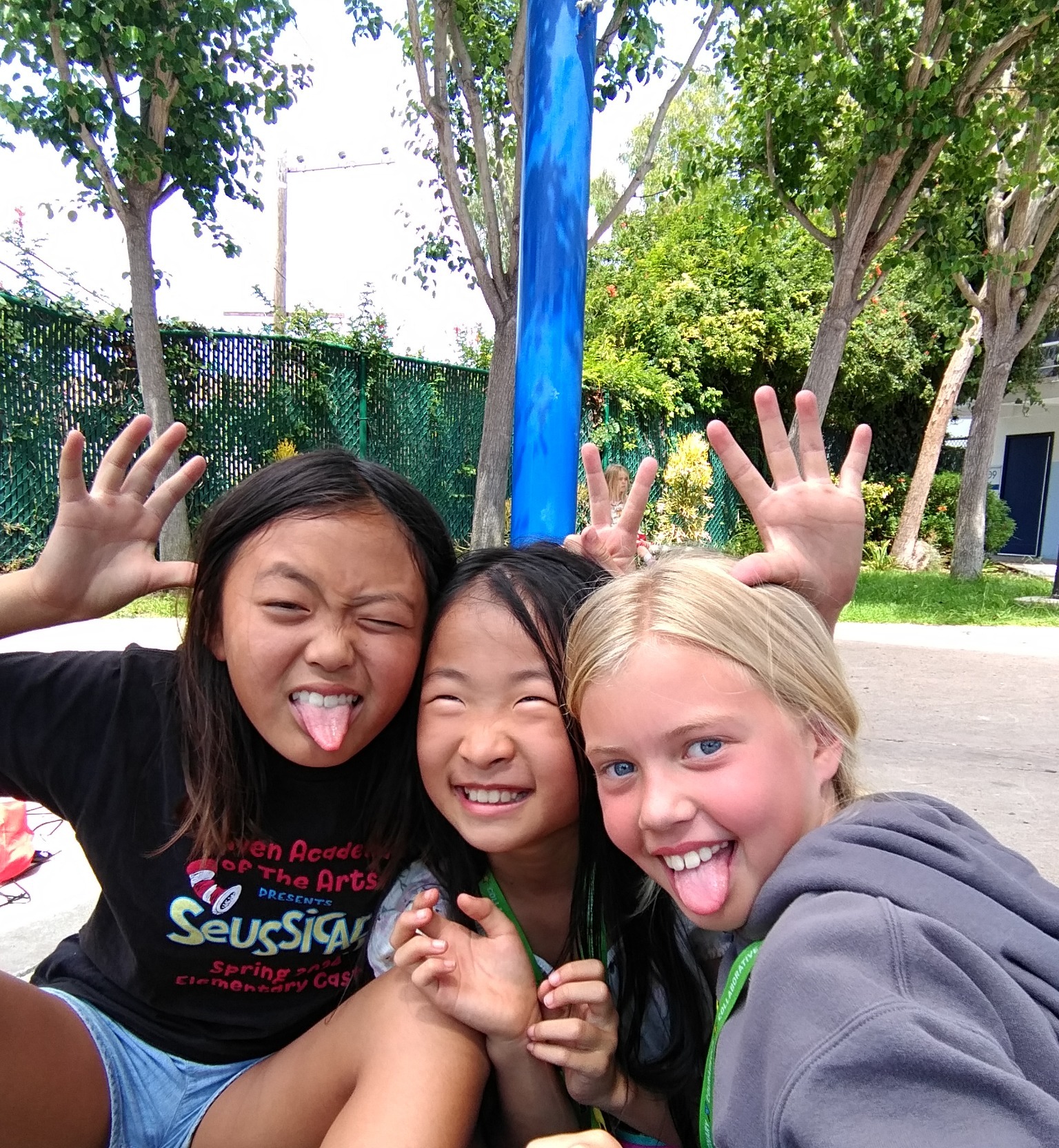 Children and a friend sharing an outdoor selfie