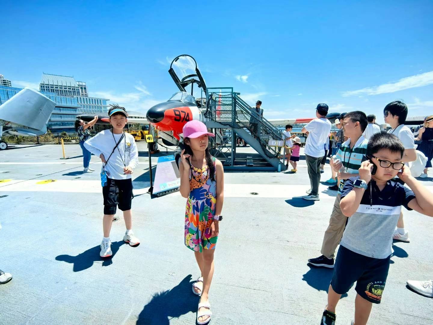 Children using audio guides at an aircraft exhibition