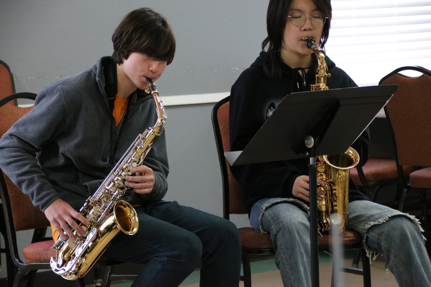 Students rehearsing on saxophones