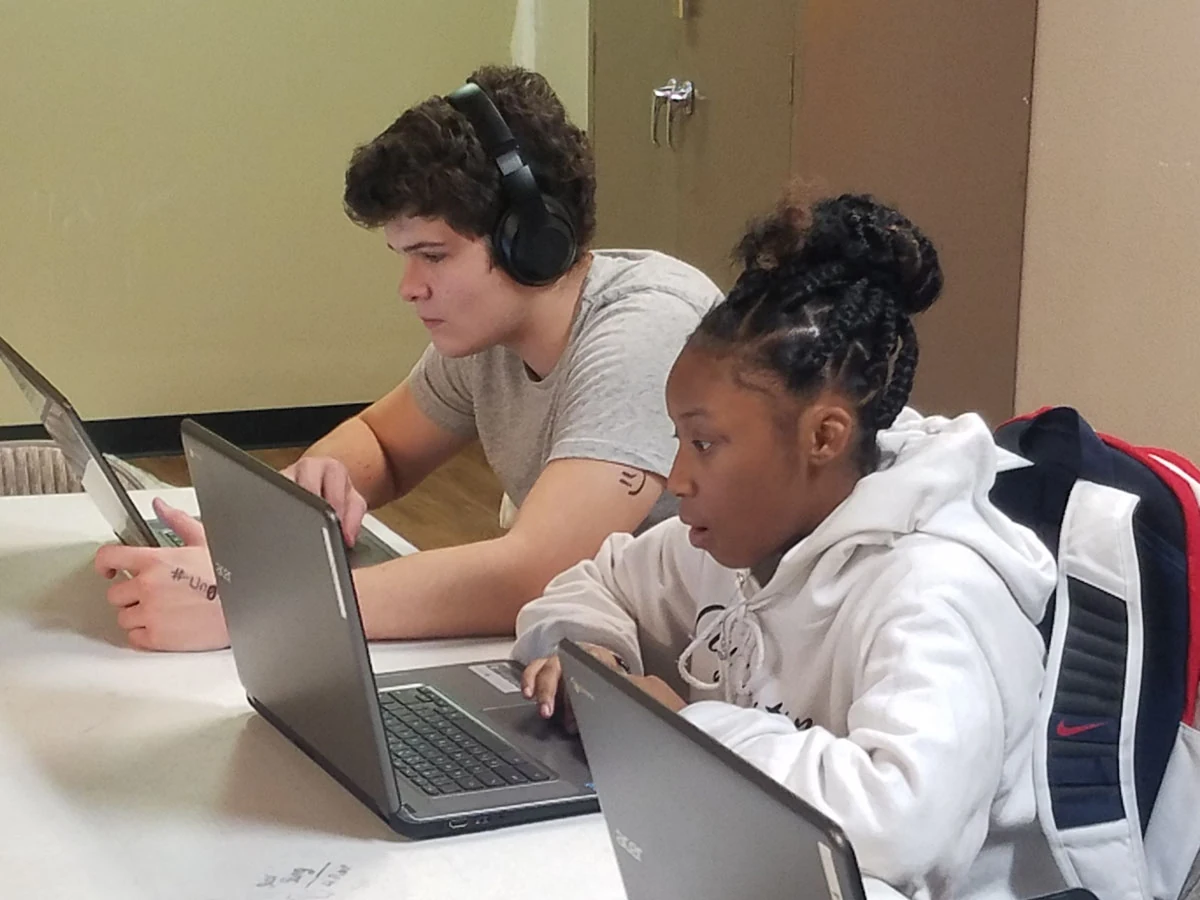 Students working with laptops