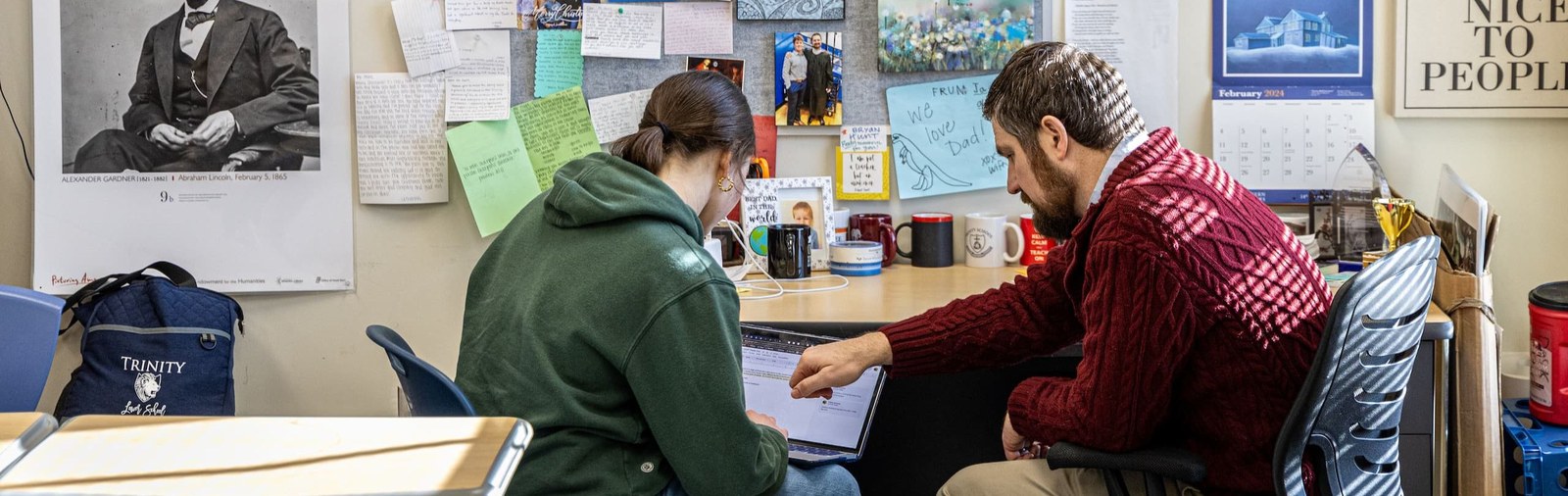 A student and teacher working together