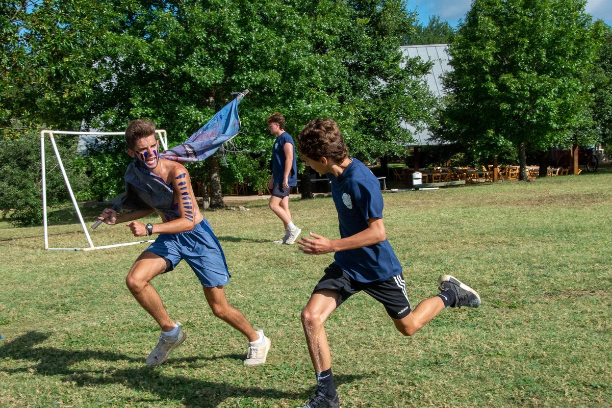 Campers play a running game on the field