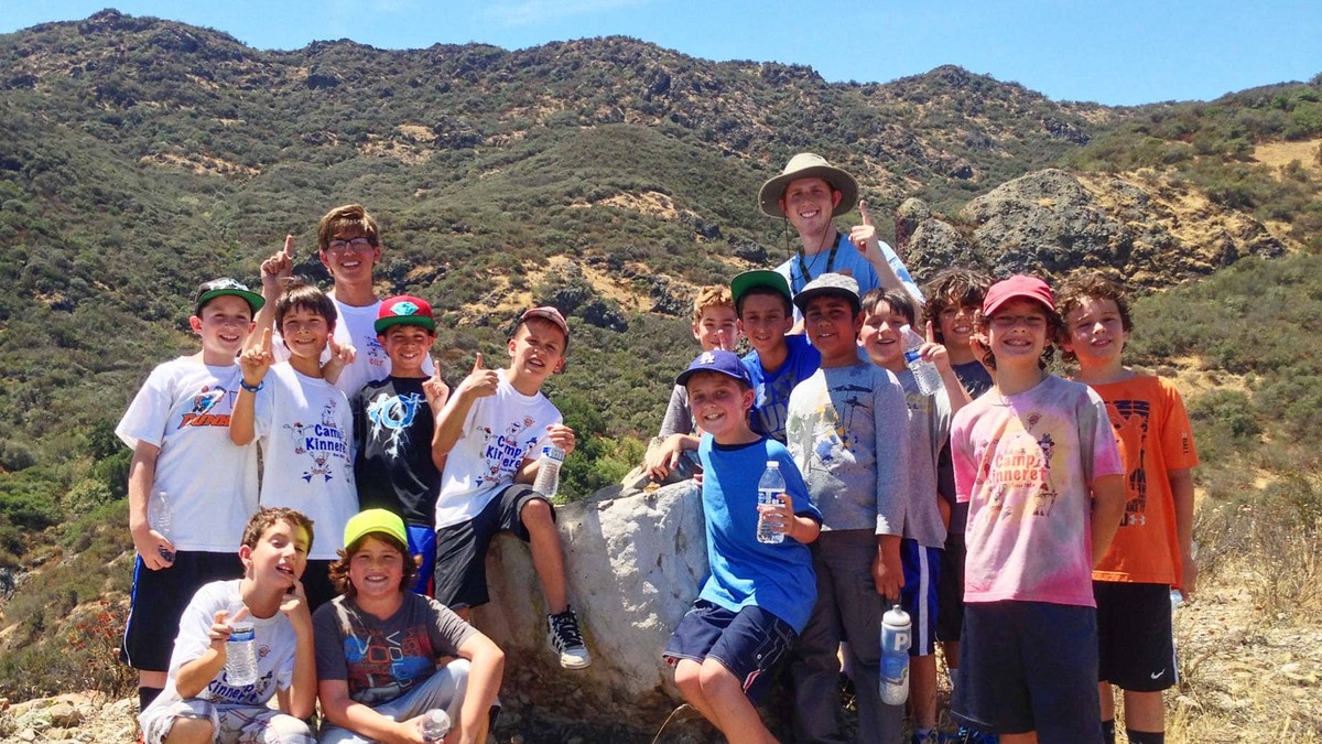 Past Camp Kinneret activity: a group photograph during a hillside hike