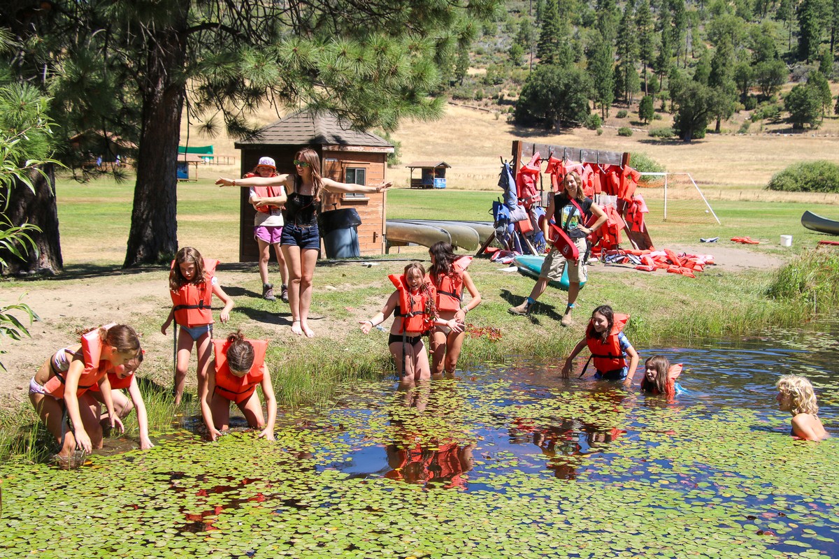 2026 waterfront activity: a group in life jackets at the lake