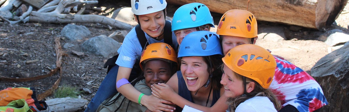 Gold Arrow Camp: campers gathered for a photo in safety helmets.