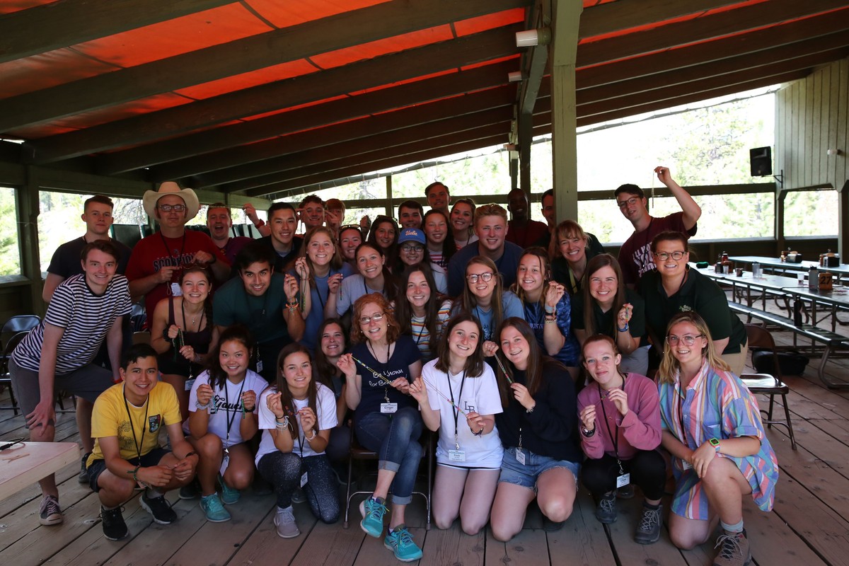 Gold Arrow Camp: staff pose with breathing beads made during training in 2019.