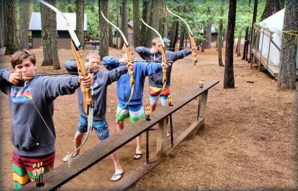 Past Mountain Camp activity: archery practice among the trees