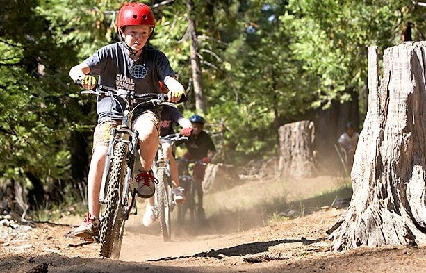 Past Mountain Camp activity: mountain biking on a woodland trail