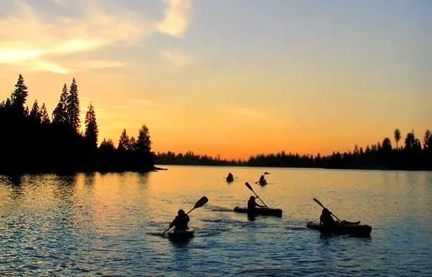 Past Mountain Camp outdoor activity: paddling on the lake at sunset