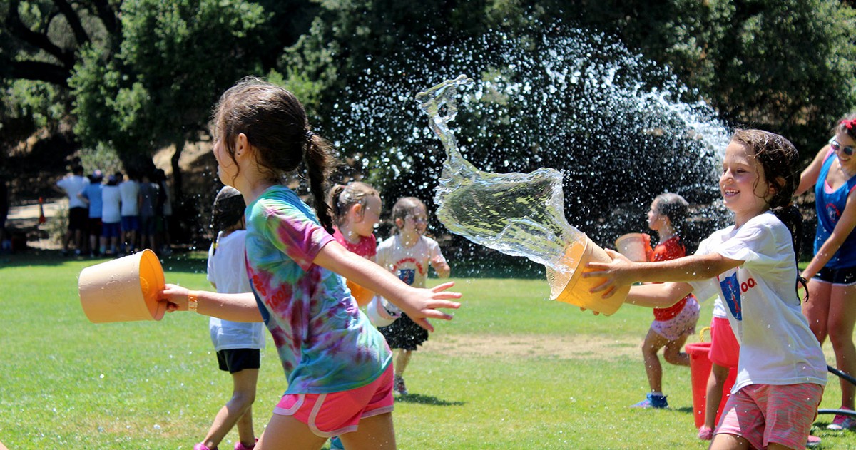 Past camp activity: water play on the lawn