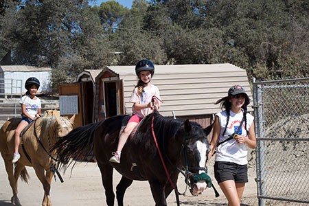 Past Day Camp: riding with staff support