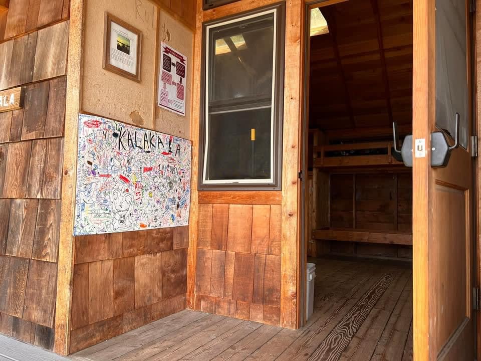 2023 school-trip archive: a Camp Orkila cabin entrance with bunk beds visible inside.