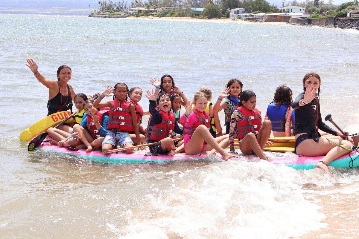 A paddleboard group by the shore