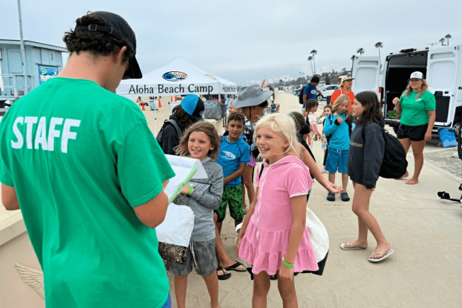 Staff check campers in before activities
