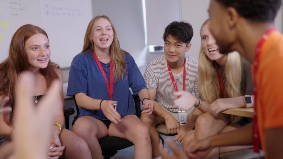 Students sharing ideas in a discussion circle