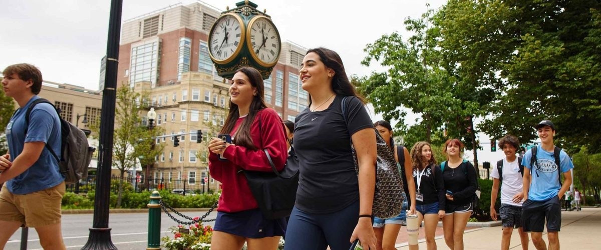 Students walking through the BU campus in summer