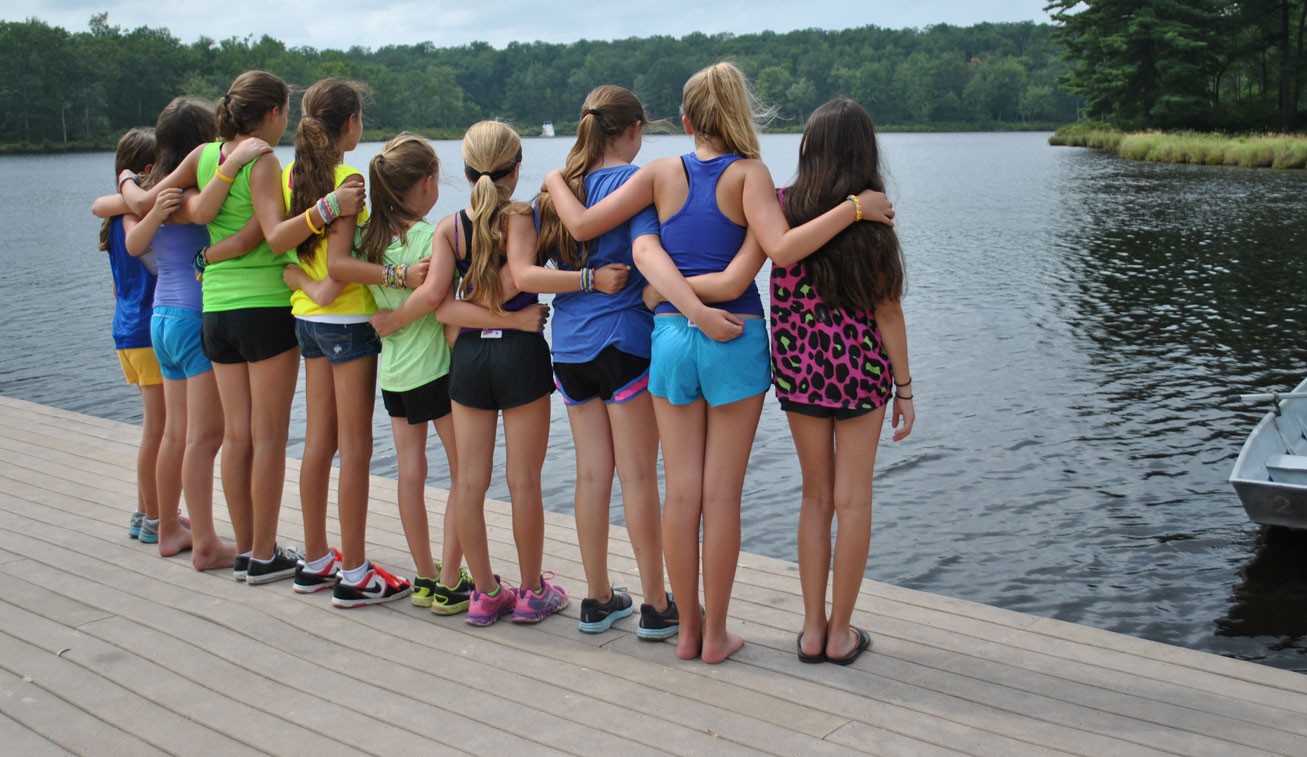 Campers together on a lakeside dock