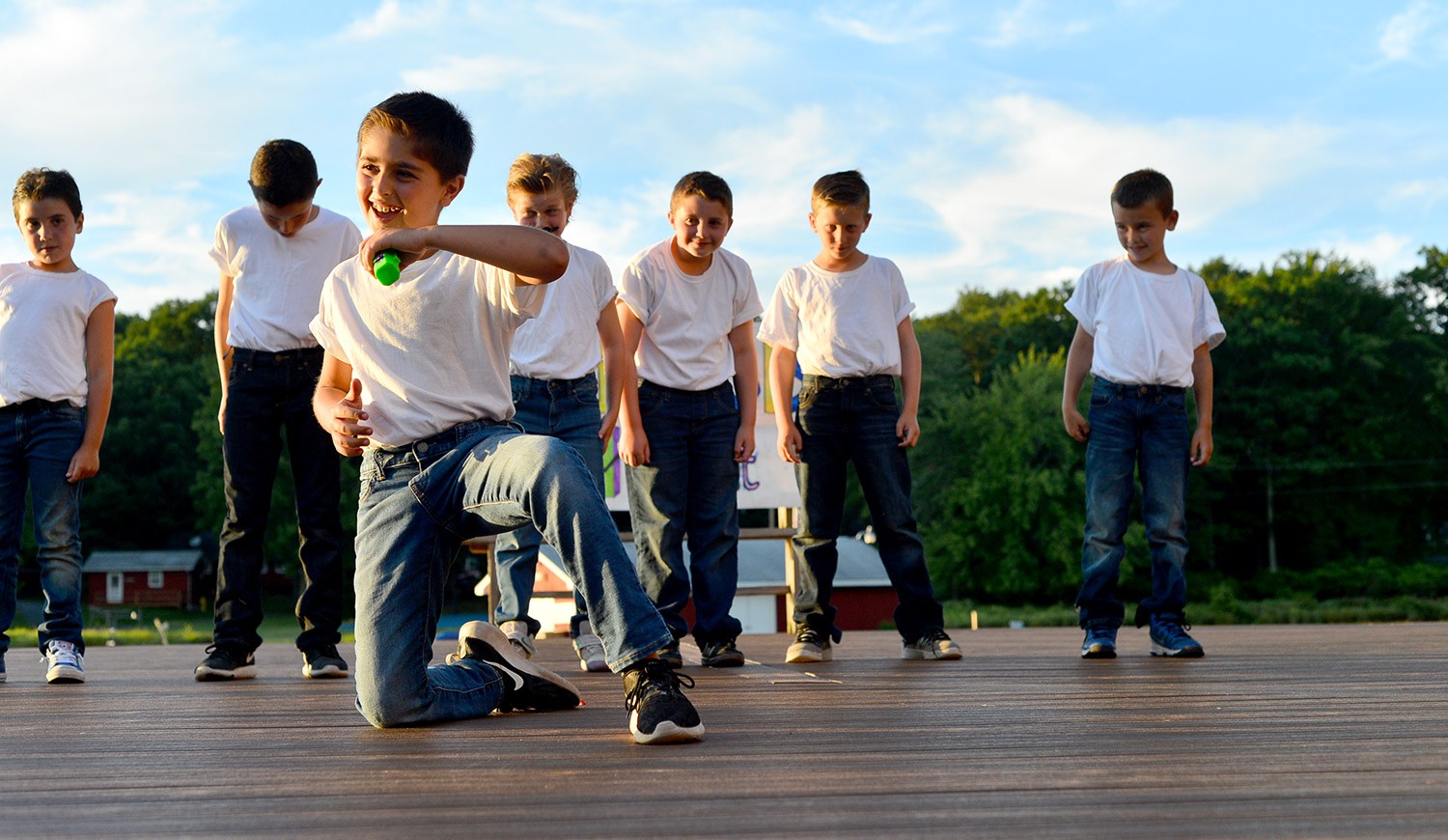 Campers performing on an outdoor stage