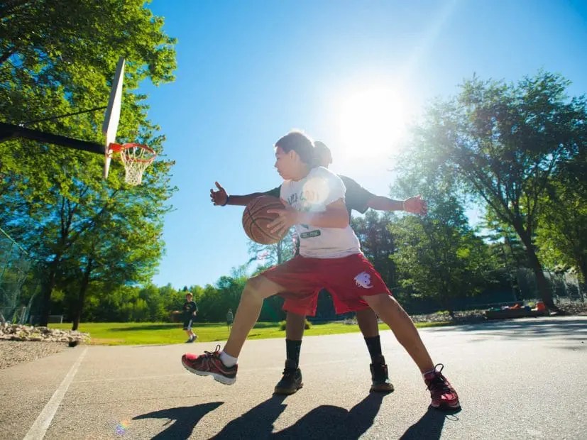 Playing basketball outdoors