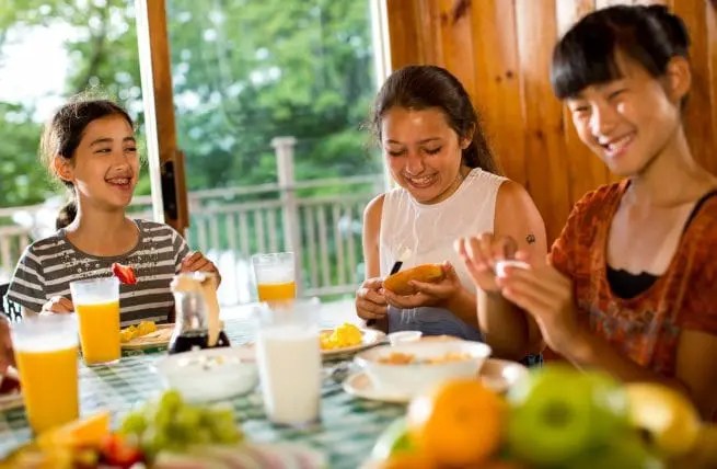 Campers eating together in the dining hall