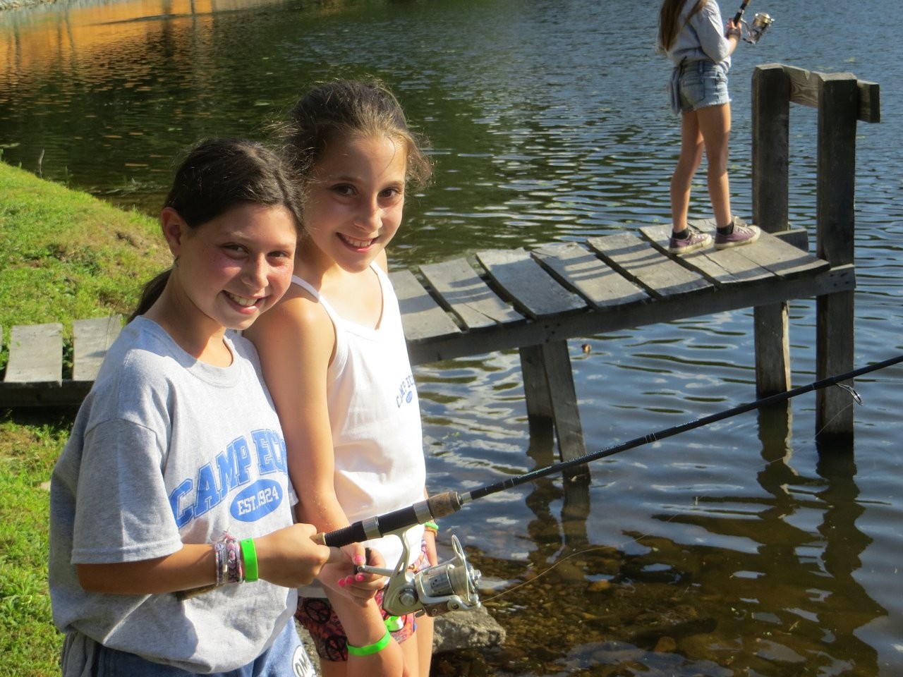 Campers fishing beside the lake