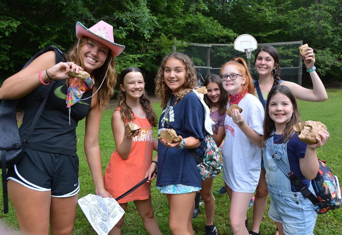 Campers display outdoor finds on the lawn
