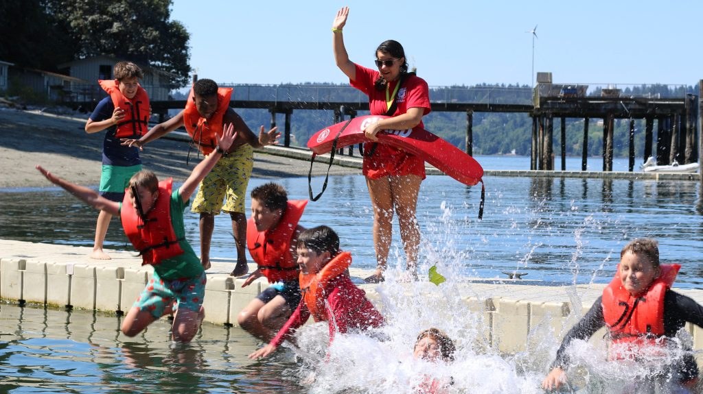 Campers taking part in waterfront activities by the dock