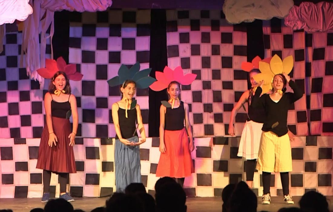 Campers performing on stage
