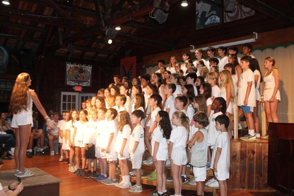 Campers taking part in a group singing activity