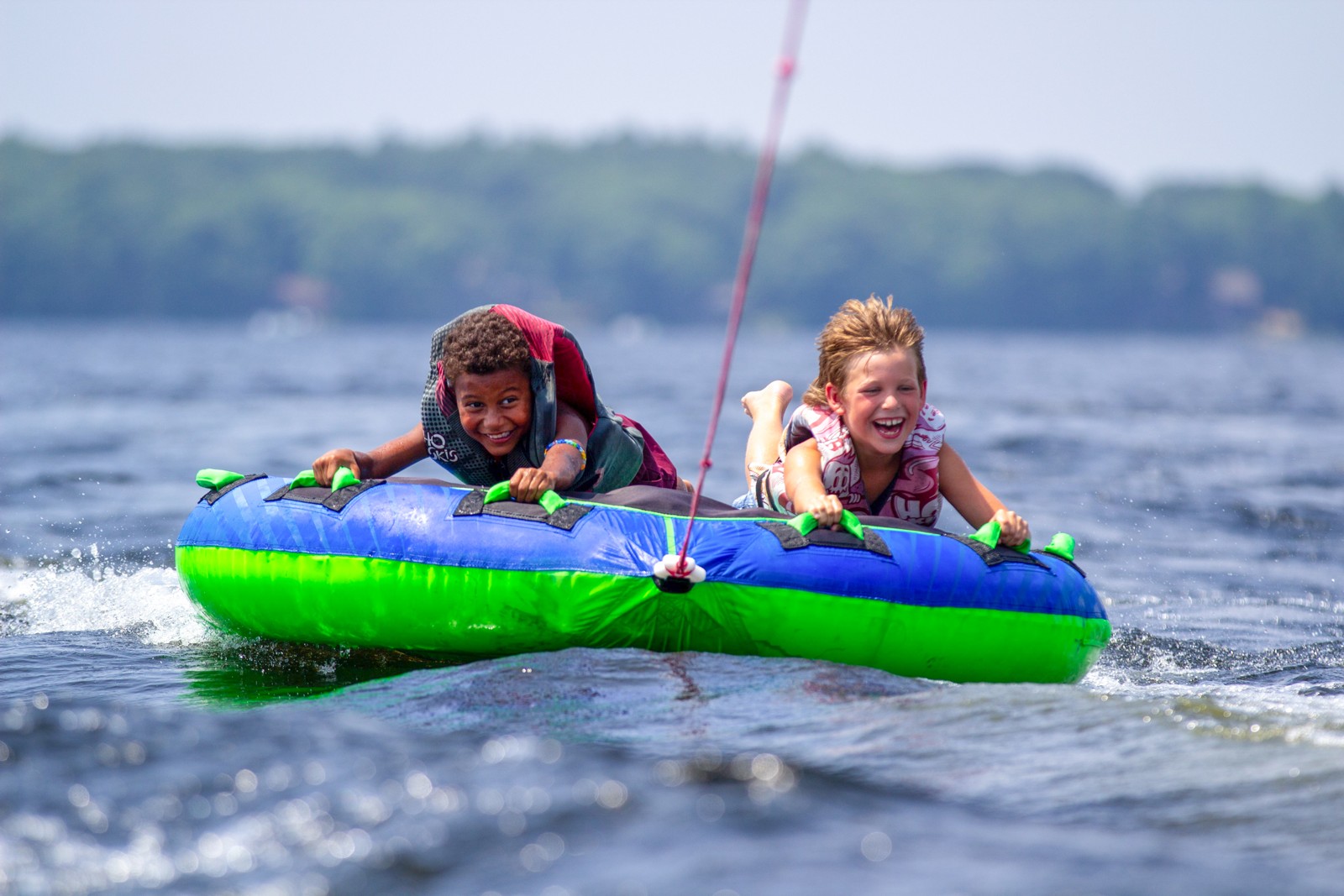 Campers tubing on the lake