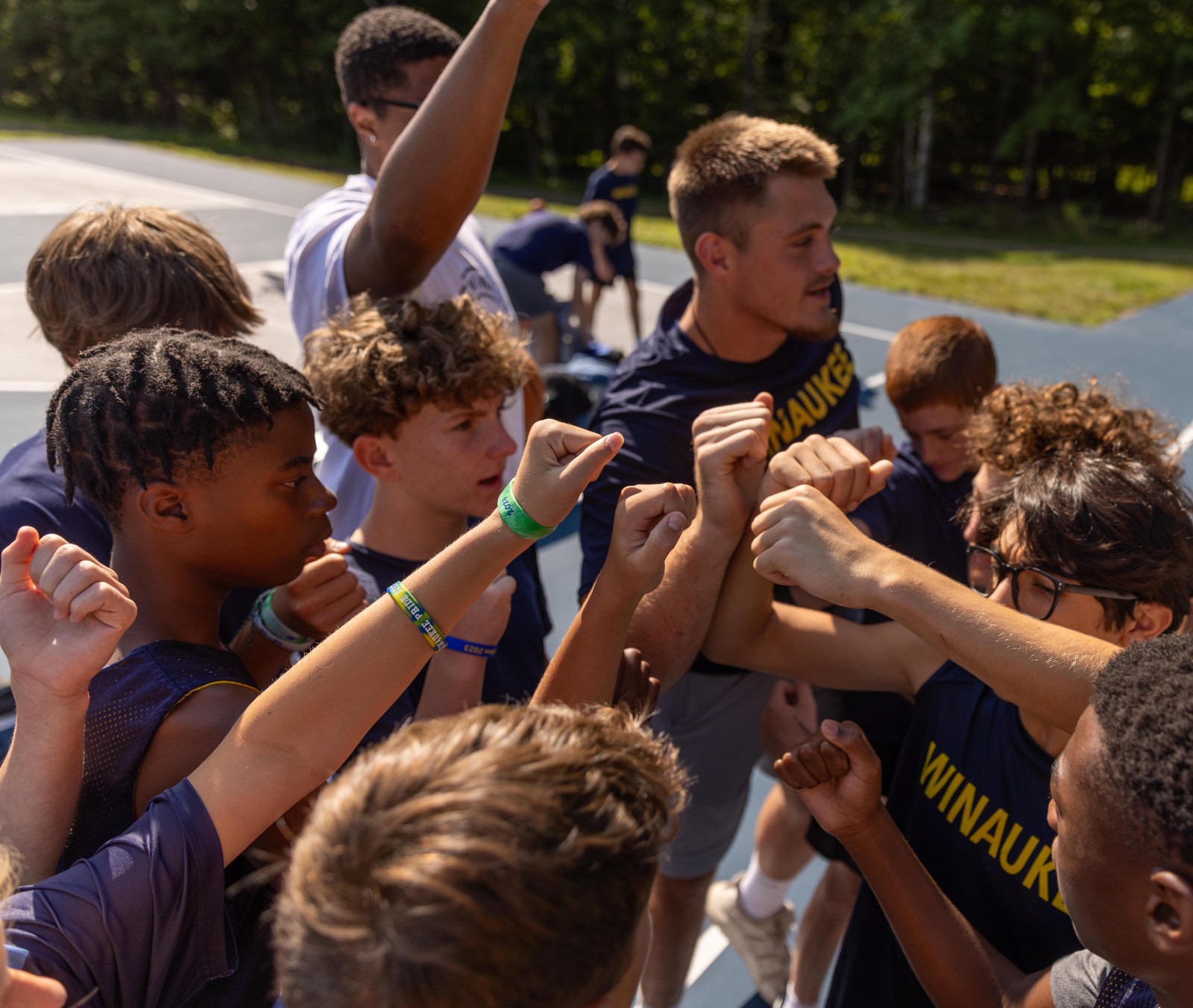 Campers gathering for a team cheer