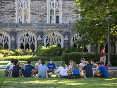 Students gathered on a Duke University campus lawn
