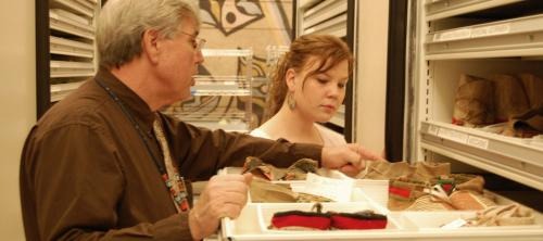 A GW Pre-College student and instructor examining materials