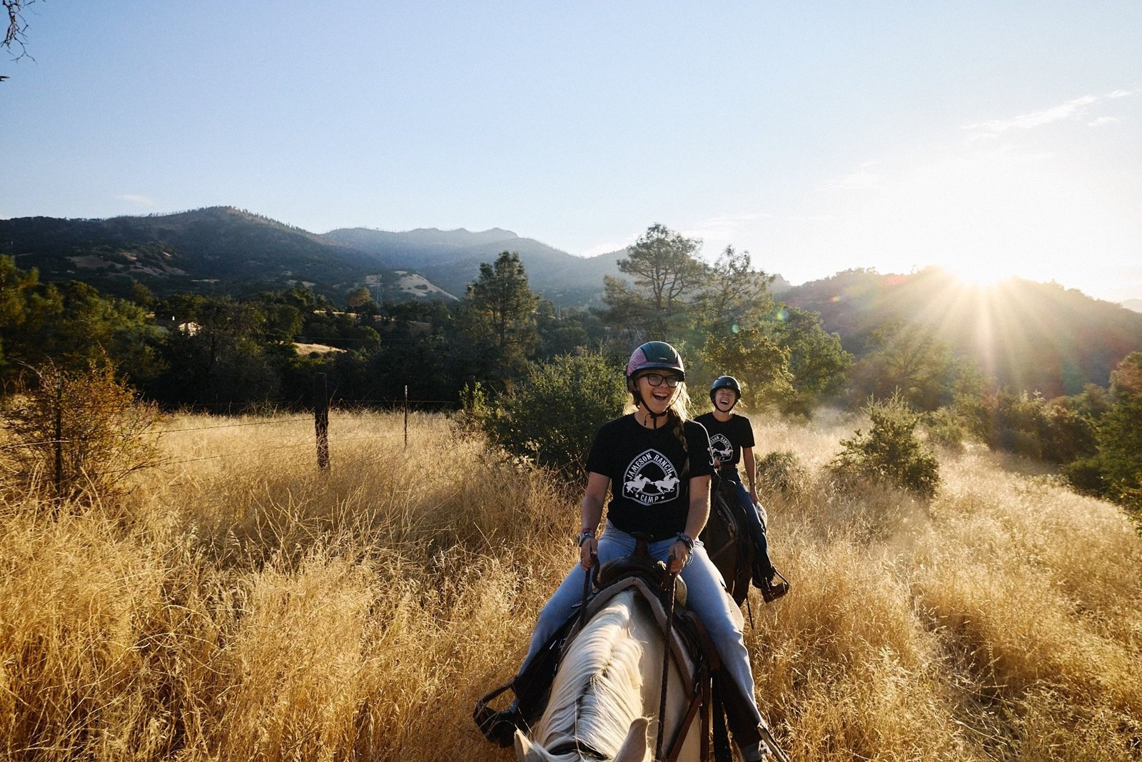 Campers ride along a ranch trail
