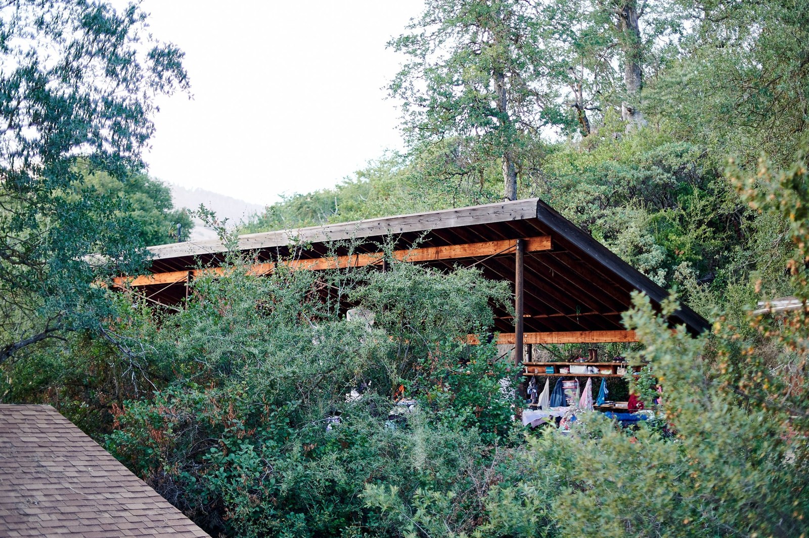 An open-air sleeping porch among trees
