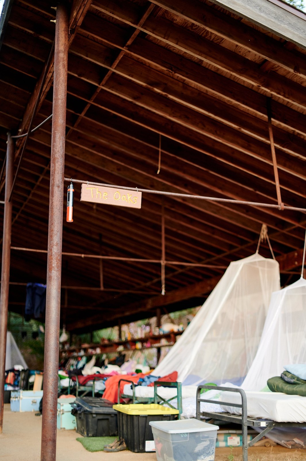 Beds and mosquito netting in an open-air sleeping porch