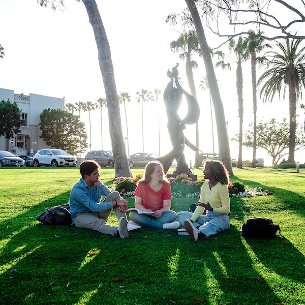 Students gathering on an LMU campus lawn