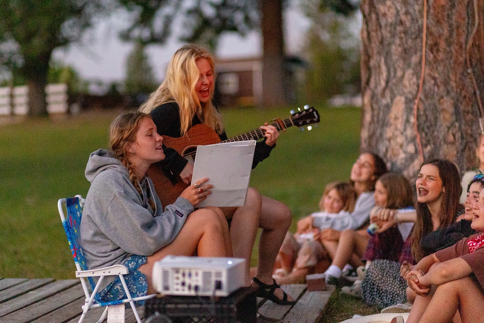 Campers and staff share music outdoors