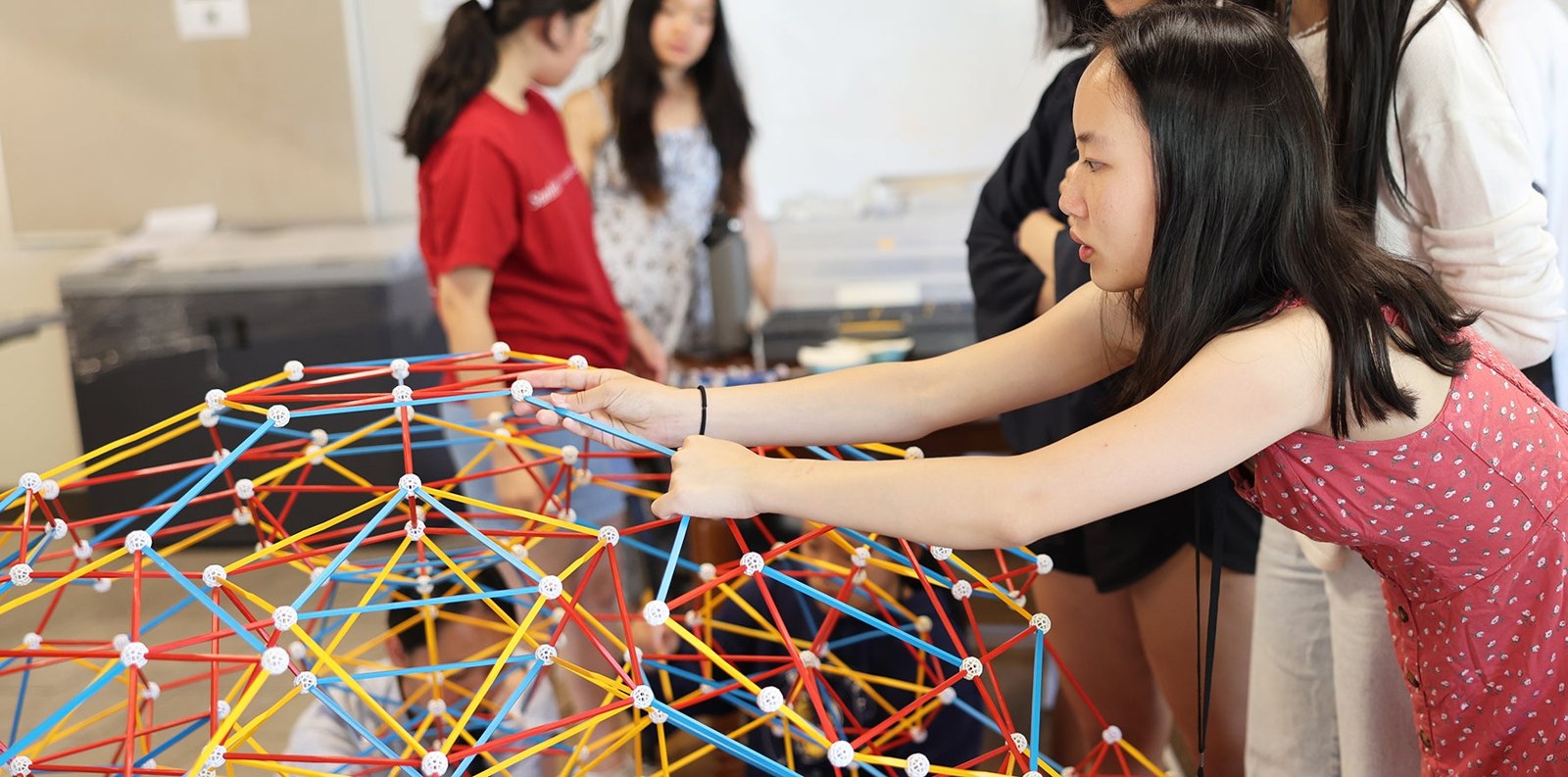 SUMaC students constructing a geometric structure together