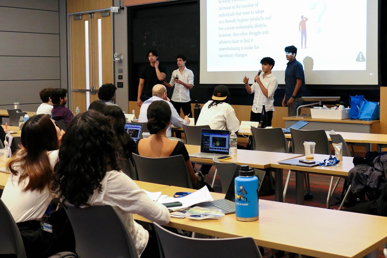 Students giving a group presentation in class