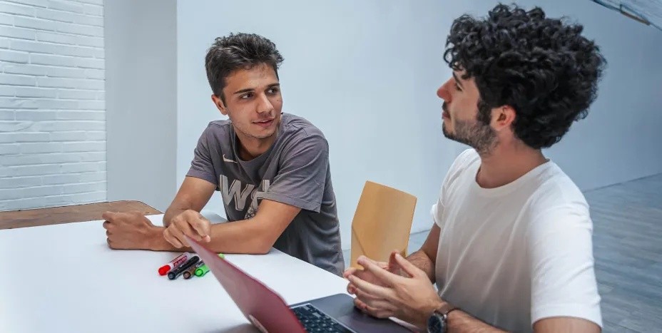Tufts Pre-College students talking in a classroom