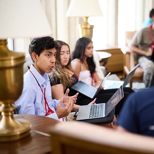 YYGS students sharing ideas in a small-group discussion