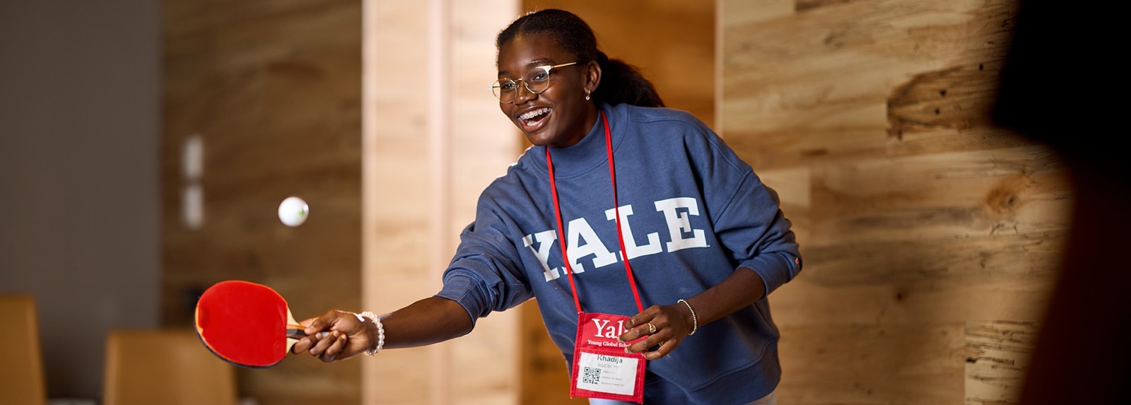 A student enjoying indoor table tennis