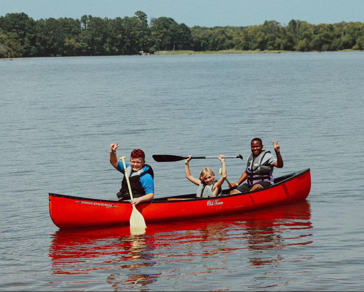 A group canoe outing on the lake